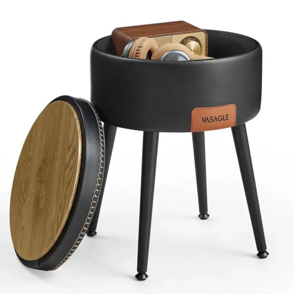 Black faux leather storage ottoman footstool with an industrial-style frame, offering a versatile seating, storage, and footrest solution for modern interiors.
