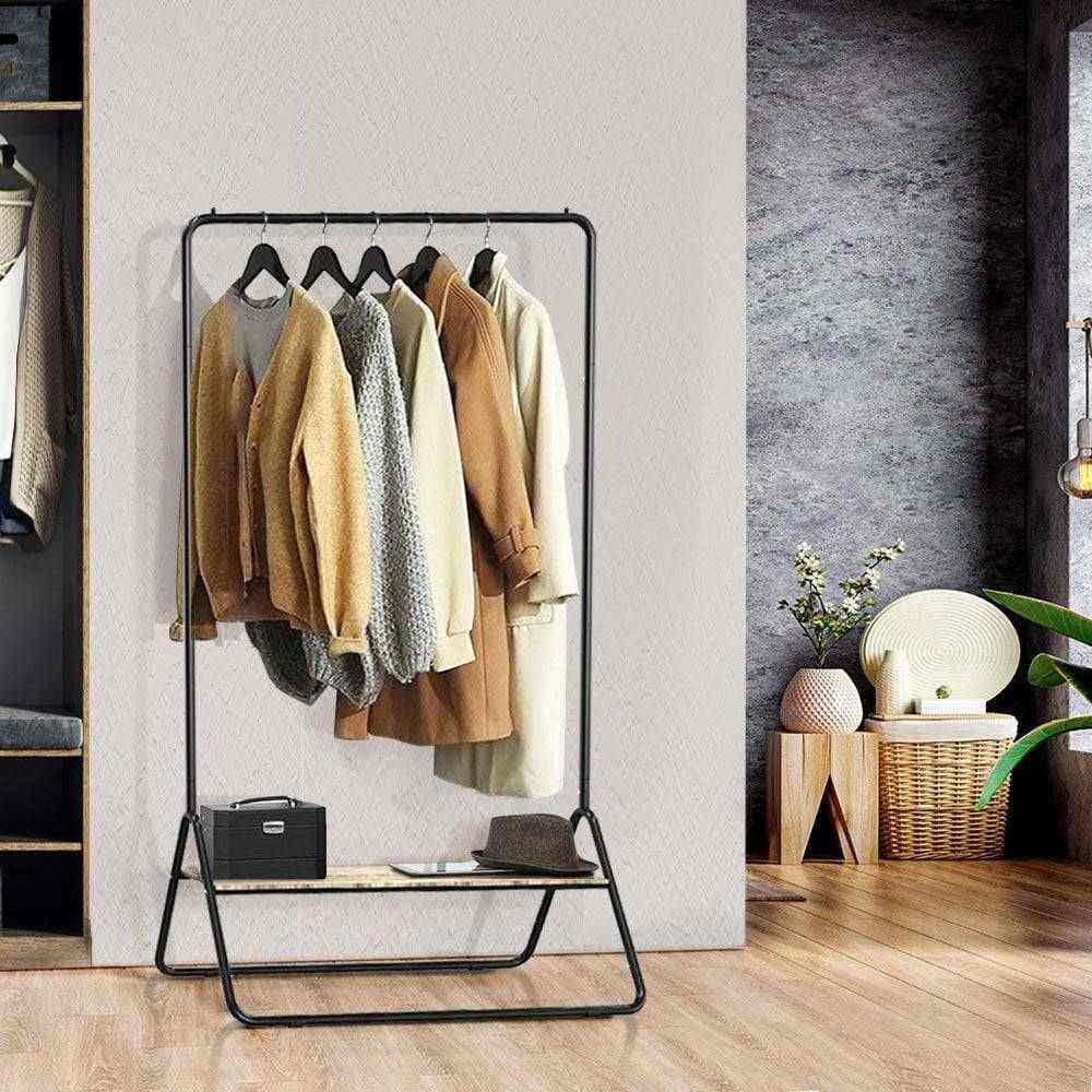 Stylish metal clothes rail with a sturdy wooden storage shelf, perfect for organising garments and accessories.
