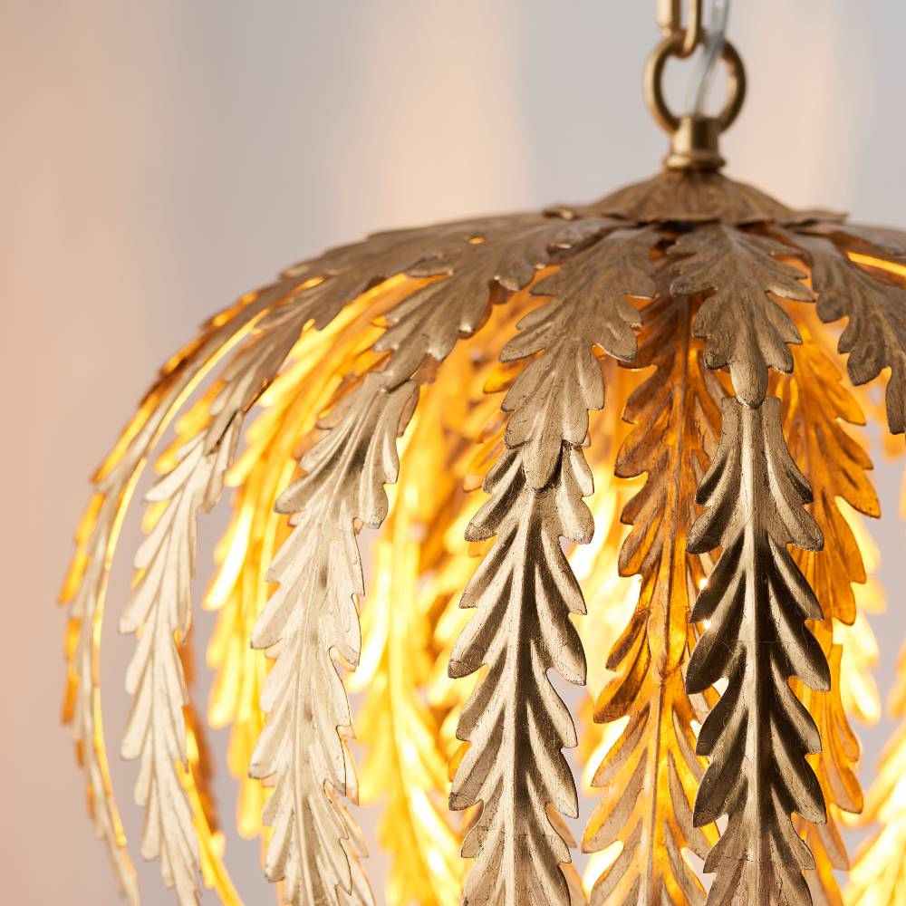 Luxurious gold leaf-finished pendant light, blending classic elegance with artistic craftsmanship.
