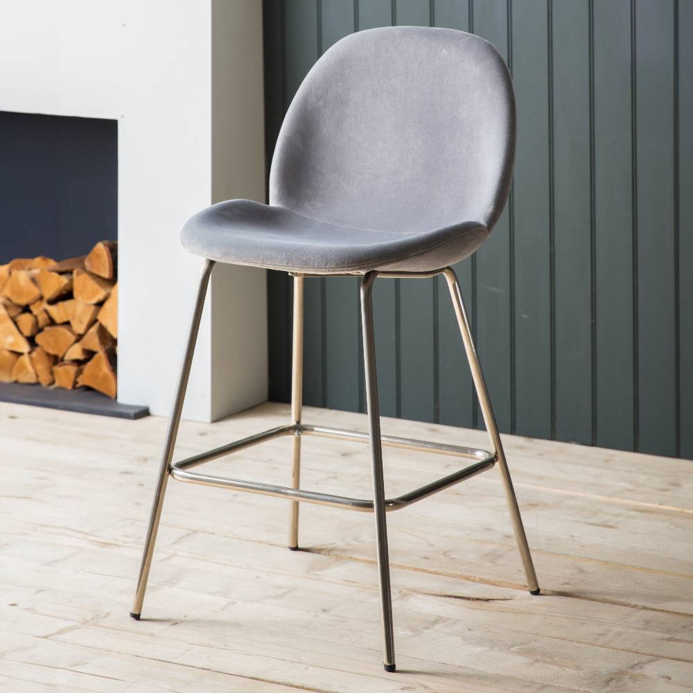 Set of two modern light grey velvet bar stools, featuring a sleek design and plush upholstery for superior comfort.
