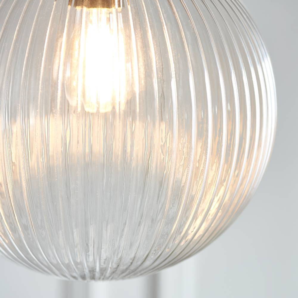 Stylish traditional pendant light with a ribbed glass shade and antique brass finish for a refined touch.
