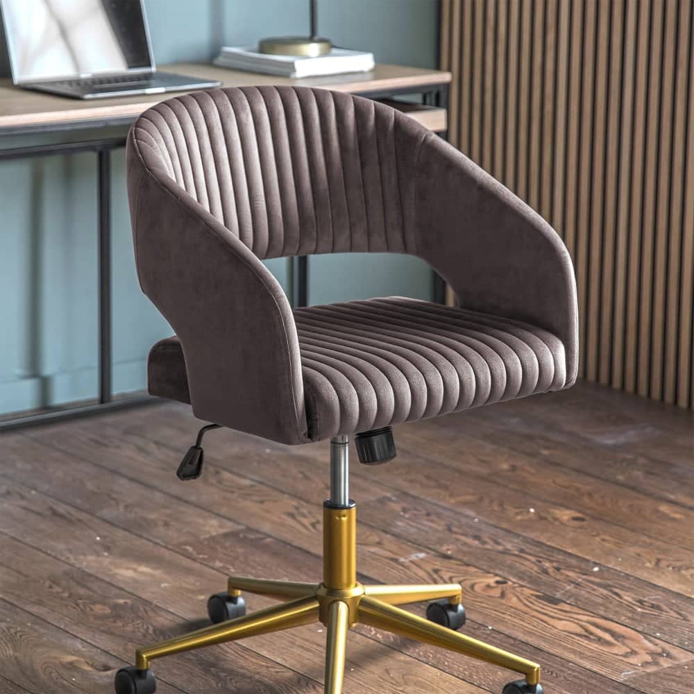 Enhance your workspace with this stylish warm grey velvet swivel office chair, designed for both comfort and elegance, featuring a ribbed seat and backrest, adjustable height, and smooth-rolling castor wheels.
